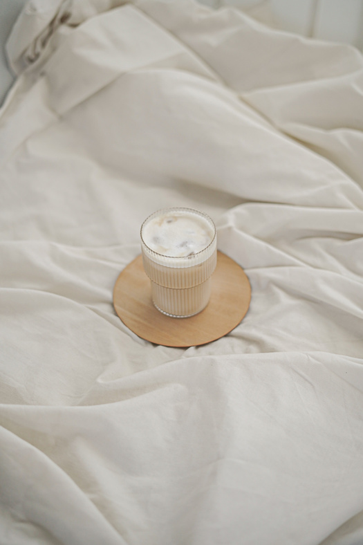 Brown and White Round Container on White Textile